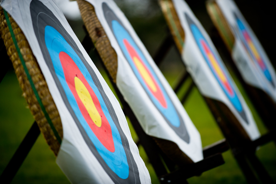 a courful photo of archery targets lined up in a row