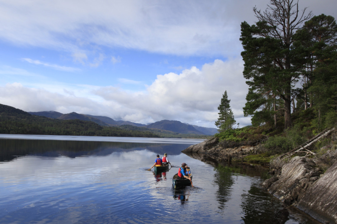 2 canoes on a calm, quiet Loch Beinn a Mheadhoin (pronounced ben-a-vane)