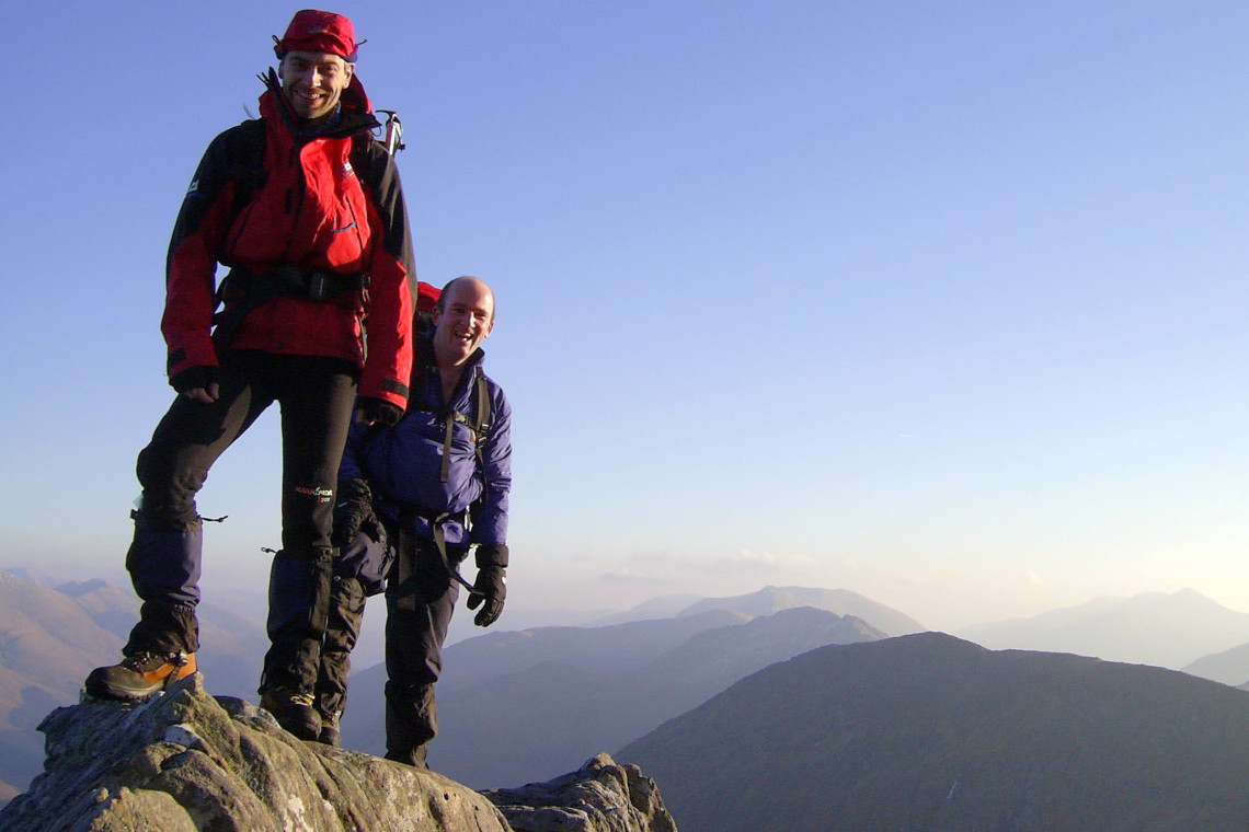 2 men at the summit of the forcan ridge in the west highlands, Glenshiel area.