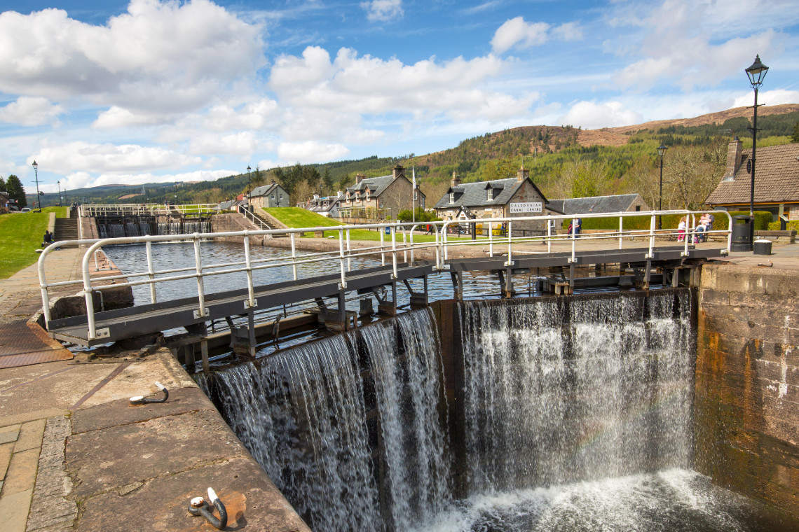 caledonian canal locks with water spilling over at fort augustus on the great glen canoe trail